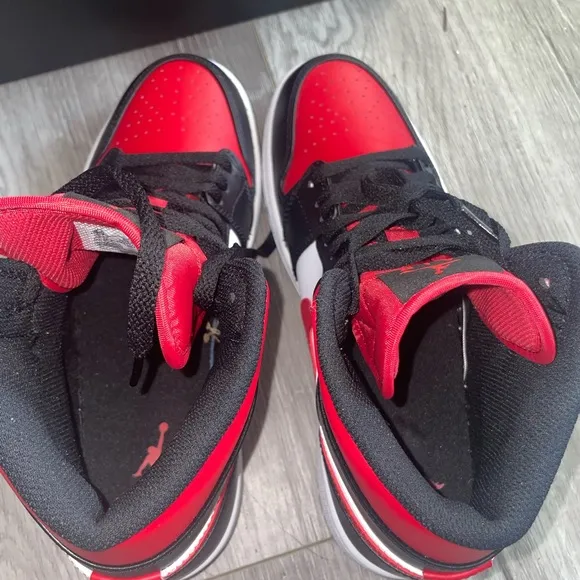 Air Jordan 1 mid-retro in red/black. Size 8.5 M