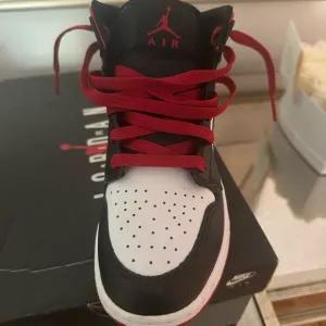 Air Jordan 11 Retro White and Black Sneakers
