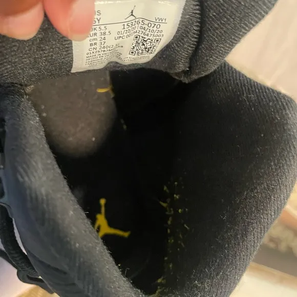 Air Jordan 12 Retro Black and Gold Sneakers