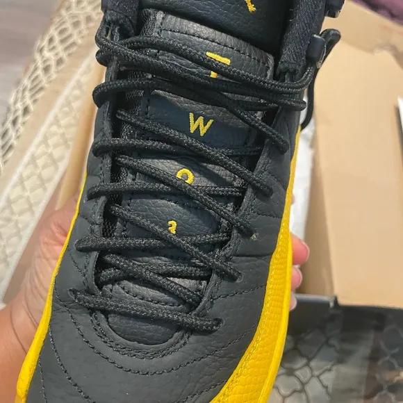 Air Jordan 12 Retro Black and Gold Sneakers