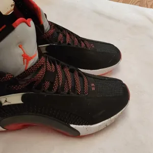 Air Jordan 35sneakers, specifically the &quot;Bred&quot;. Bots 6.5= Women 8.