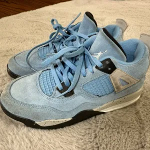Air Jordan 4 Retro University Blue Sneakers