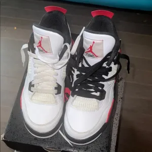 Air Jordan Retro 4 White and Black Sneakers