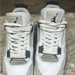Air Jordan Retro 4 White and Black Sneakers