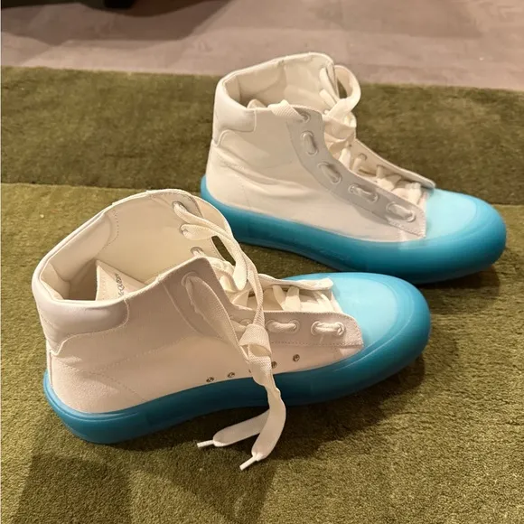 Alexander McQueen clean!!!! White Sneakers with sky Blue Soles worn once.