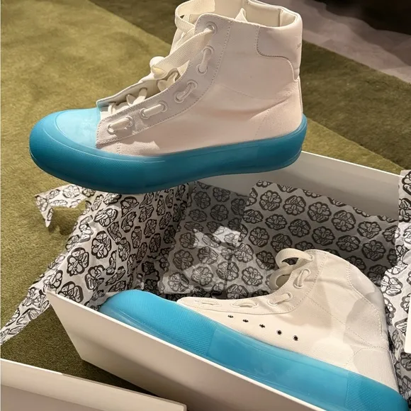 Alexander McQueen clean!!!! White Sneakers with sky Blue Soles worn once.