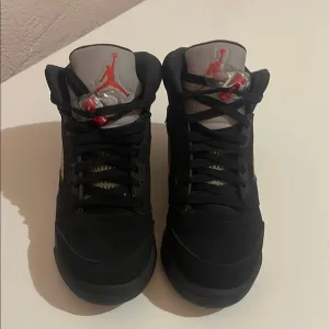 Black Air Jordan Sneakers with Red Accents