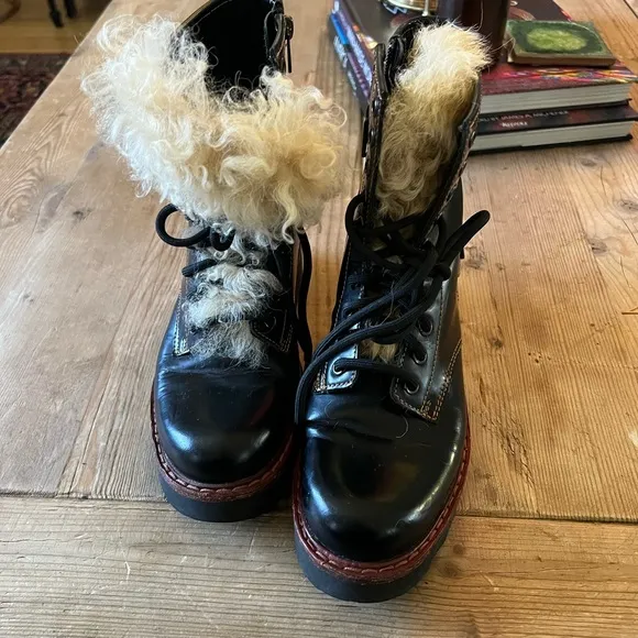 Coach woman’s black Moto Hiker boot with cream colored Shearling boots