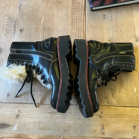 Coach woman’s black Moto Hiker boot with cream colored Shearling boots