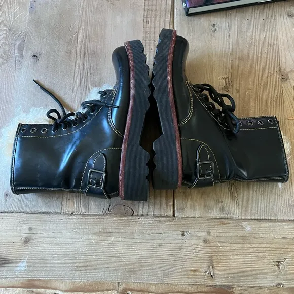Coach woman’s black Moto Hiker boot with cream colored Shearling boots