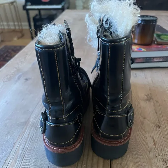 Coach woman’s black Moto Hiker boot with cream colored Shearling boots