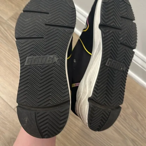 Golden Goose Black and Yellow Sneakers with Retro Vibes