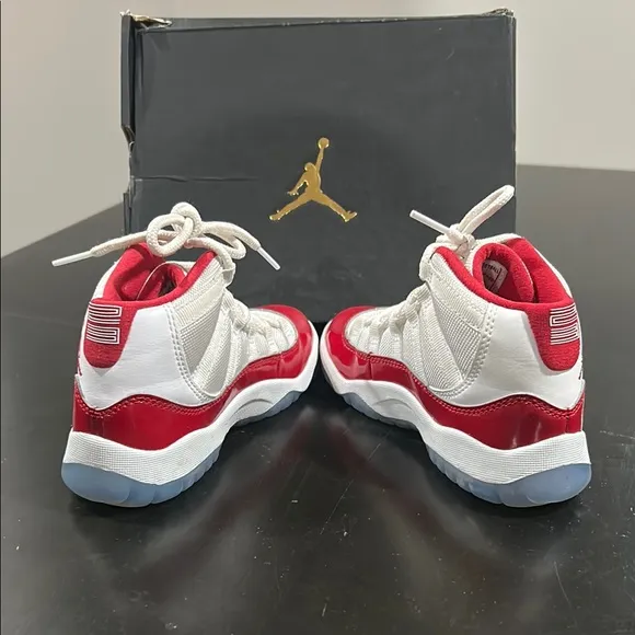 JORDAN 11 RETRO Kid’s Jordan Red and White Sneakers
