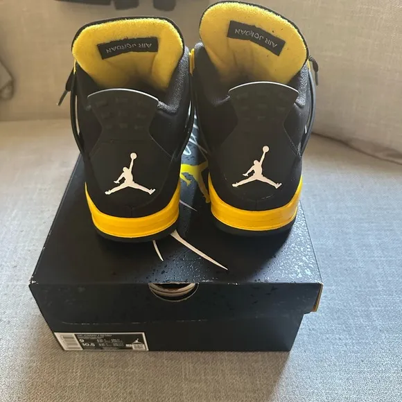 Jordan 4 a Retro Black and Yellow Sneakers