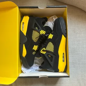 Jordan 4 a Retro Black and Yellow Sneakers