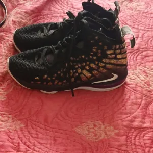 LeBron 17 Black and Gold Athletic Sneakers