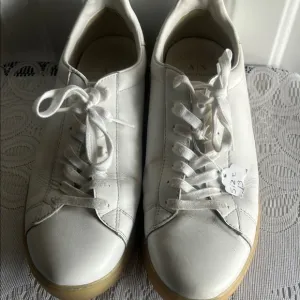 Men’s Armani Exchange White Sneakers.