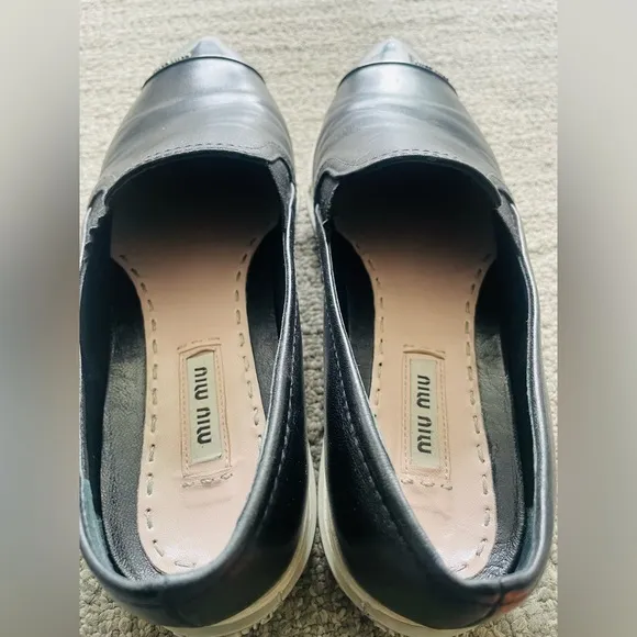 MIU MIU Women’s Black Leather Flats With Silver Toe Cap