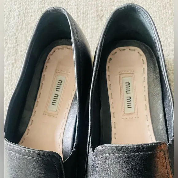 MIU MIU Women’s Black Leather Flats With Silver Toe Cap