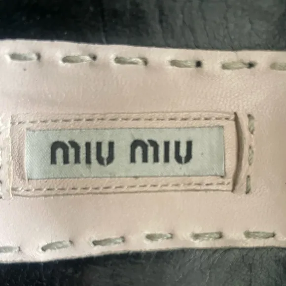 MIU MIU Women’s Black Leather Flats With Silver Toe Cap