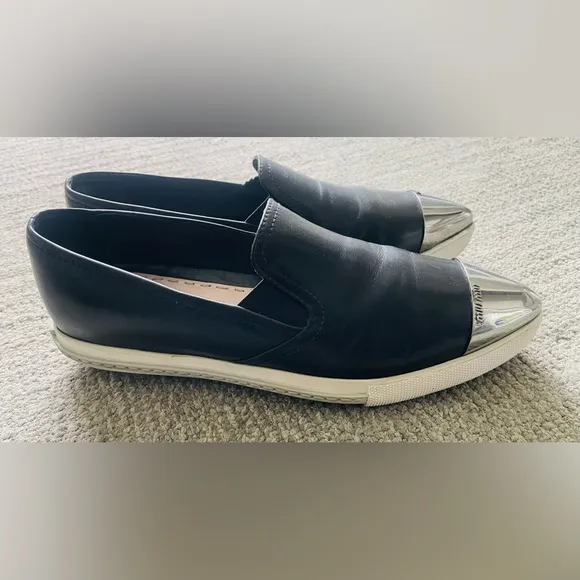 MIU MIU Women’s Black Leather Flats With Silver Toe Cap