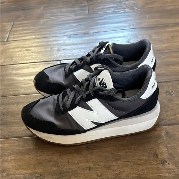 New Balance women’s 237 retro Black and White Sneakers