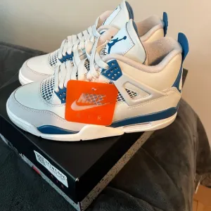 Nike Air Jordan 4 Retro White and Blue Sneakers