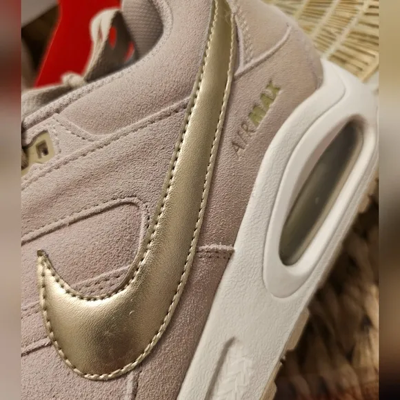 Nike Beige Sneakers with Gold Swoosh