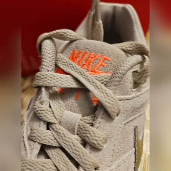 Nike Beige Sneakers with Gold Swoosh
