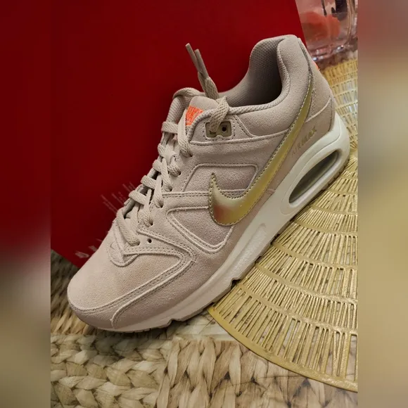 Nike Beige Sneakers with Gold Swoosh
