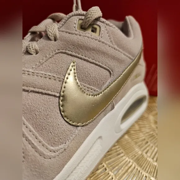 Nike Beige Sneakers with Gold Swoosh