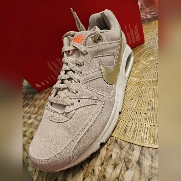 Nike Beige Sneakers with Gold Swoosh
