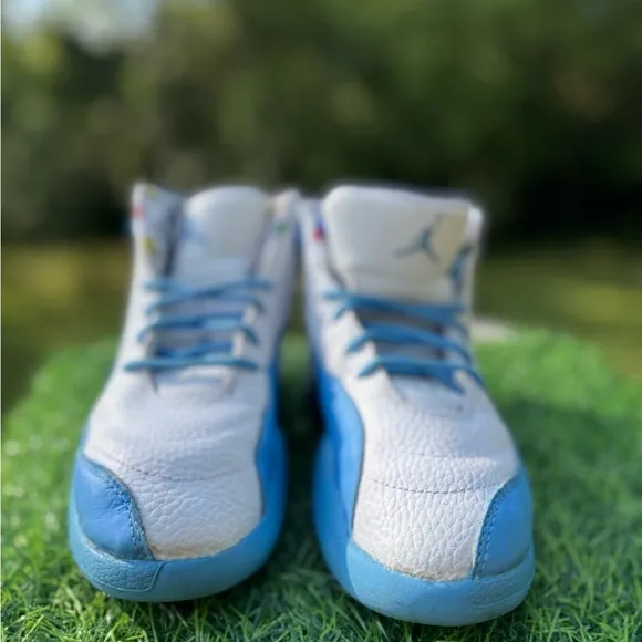 Nike Jordan 12 Retro PS Emoji sneakers.