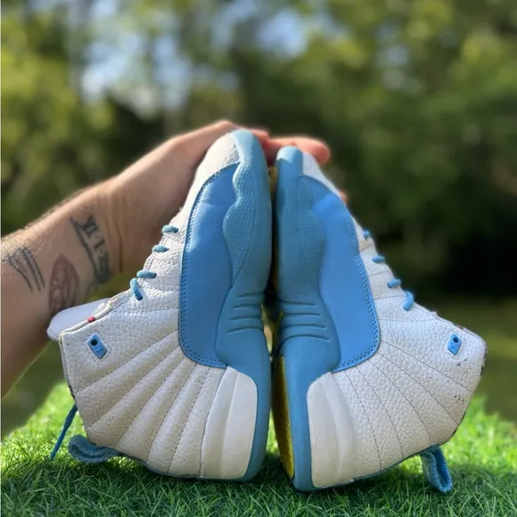 Nike Jordan 12 Retro PS Emoji sneakers.