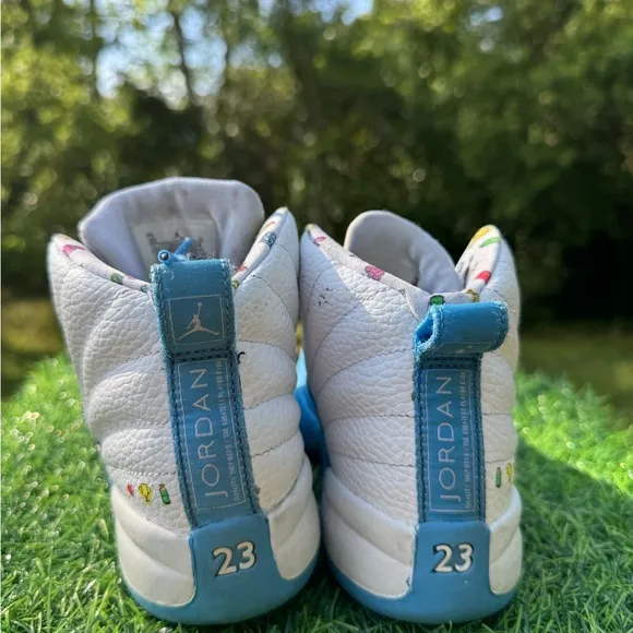 Nike Jordan 12 Retro PS Emoji sneakers.