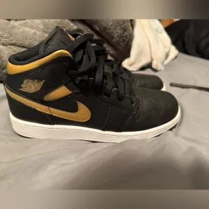 Nike Jordan Black and Gold Sneakers