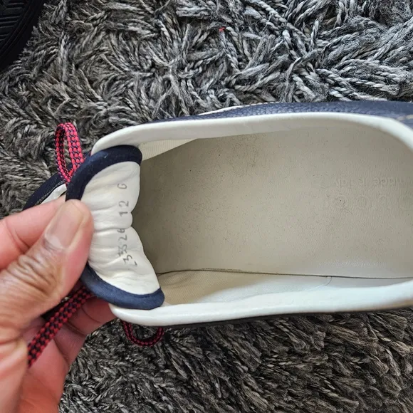Stylish Navy and White Sneakers with Red Laces
