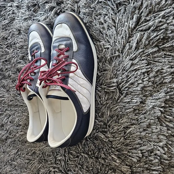 Stylish Navy and White Sneakers with Red Laces