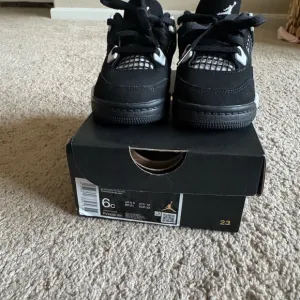 Toddle 6 C Jordan 4 Retro Black/White. Gently Used