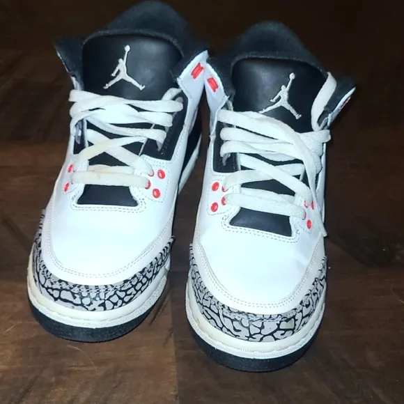 White and Black Sneakers with Red Accents