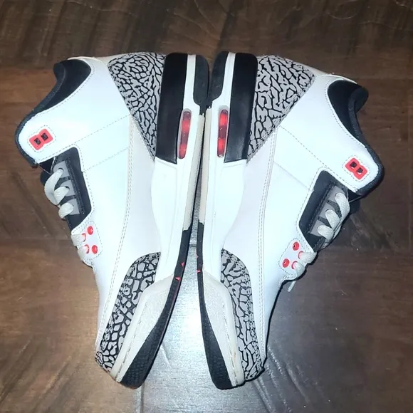 White and Black Sneakers with Red Accents