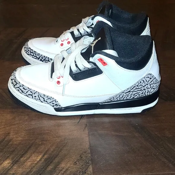 White and Black Sneakers with Red Accents
