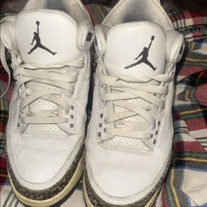 White Sneakers with Black Logo