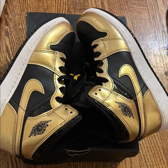 Worn 2x Air Jordan Black and Gold Sneakers size 6 kids.